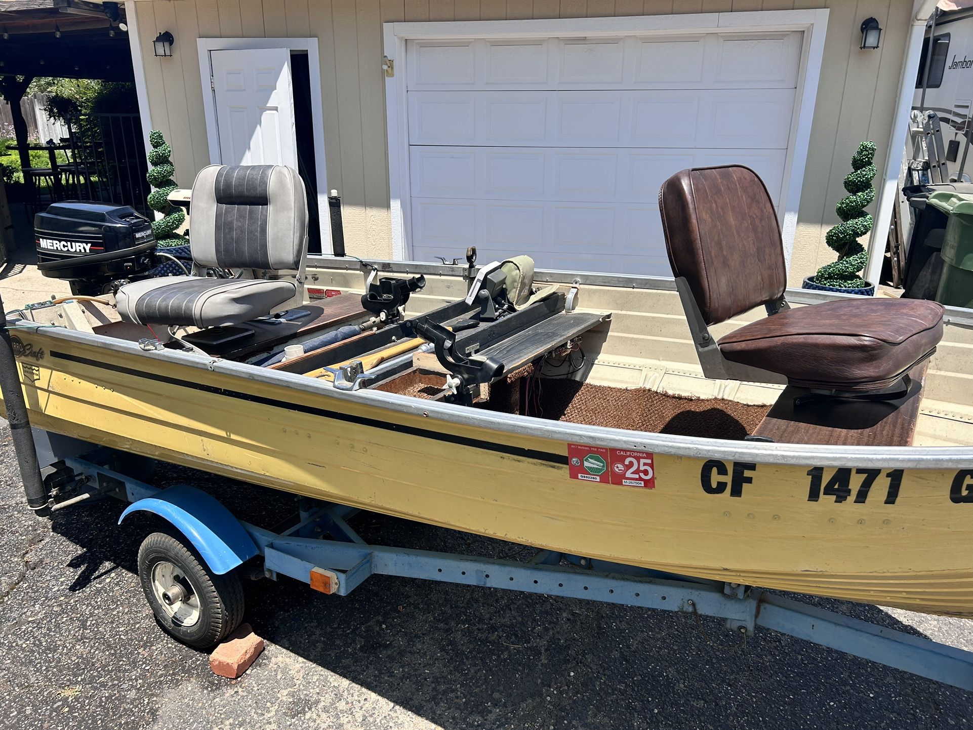 12” aluminum fishing boat with 15 horse Mercury motor, trolling motor