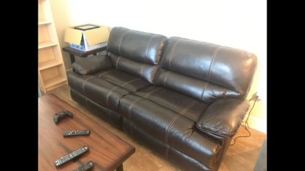 Dual power reclining brown leather sofa