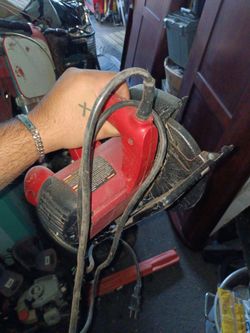 Red and Black Electric Circular Saw
