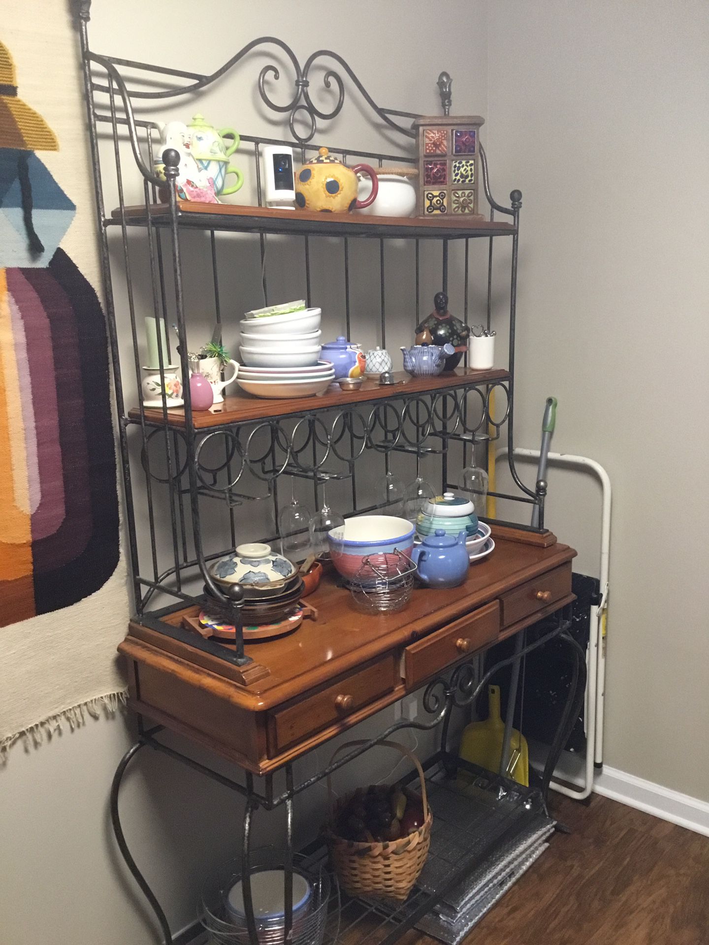 Kitchen Bakers Rack, three drawers, wine bottles with wine glasses. Solid wood, wrought iron.