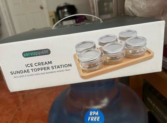 Servappétit ice cream sundae topper station, which includes six glass jars and a bamboo wood tray