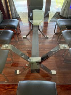 Glass table with 8 chairs