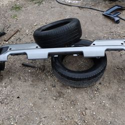 2019 To 2022 Chevy Or GMC Rear Bumper Gray In Color With Sensor Holes Top Plastic And One Step OEM Parts