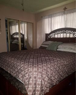 Dark Wood Bed Frame with Ornate Headboard