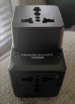 International travel adapter with USB port