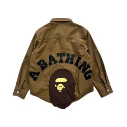 A bathing ape head shirt with ape head patch