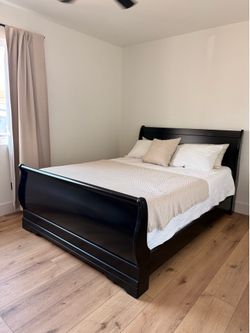 Ashley’s queen sleigh bed frame