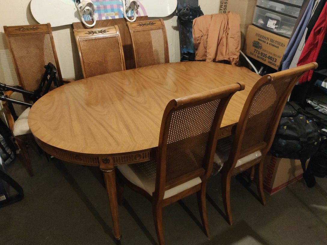 Authentic antique dinning set. Table and 6 chairs. Table has 2 additional parts to extend into 8 or 10 people table size.
