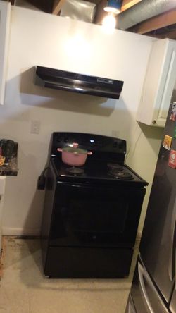 Electric stove with hood