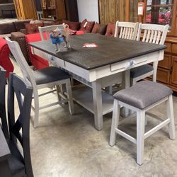 Brand new table and 424 inch stools 1088 brand new