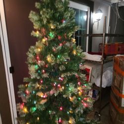 7 Feet Chritmas Tree.. Some Ligths Don't Work But U Can  Always Put Extr Ligths