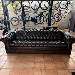 Dark brown couch, 15 feet wide. Good condition slight scratches 