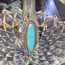 A vintage sterling silver baby blue turquoise ring