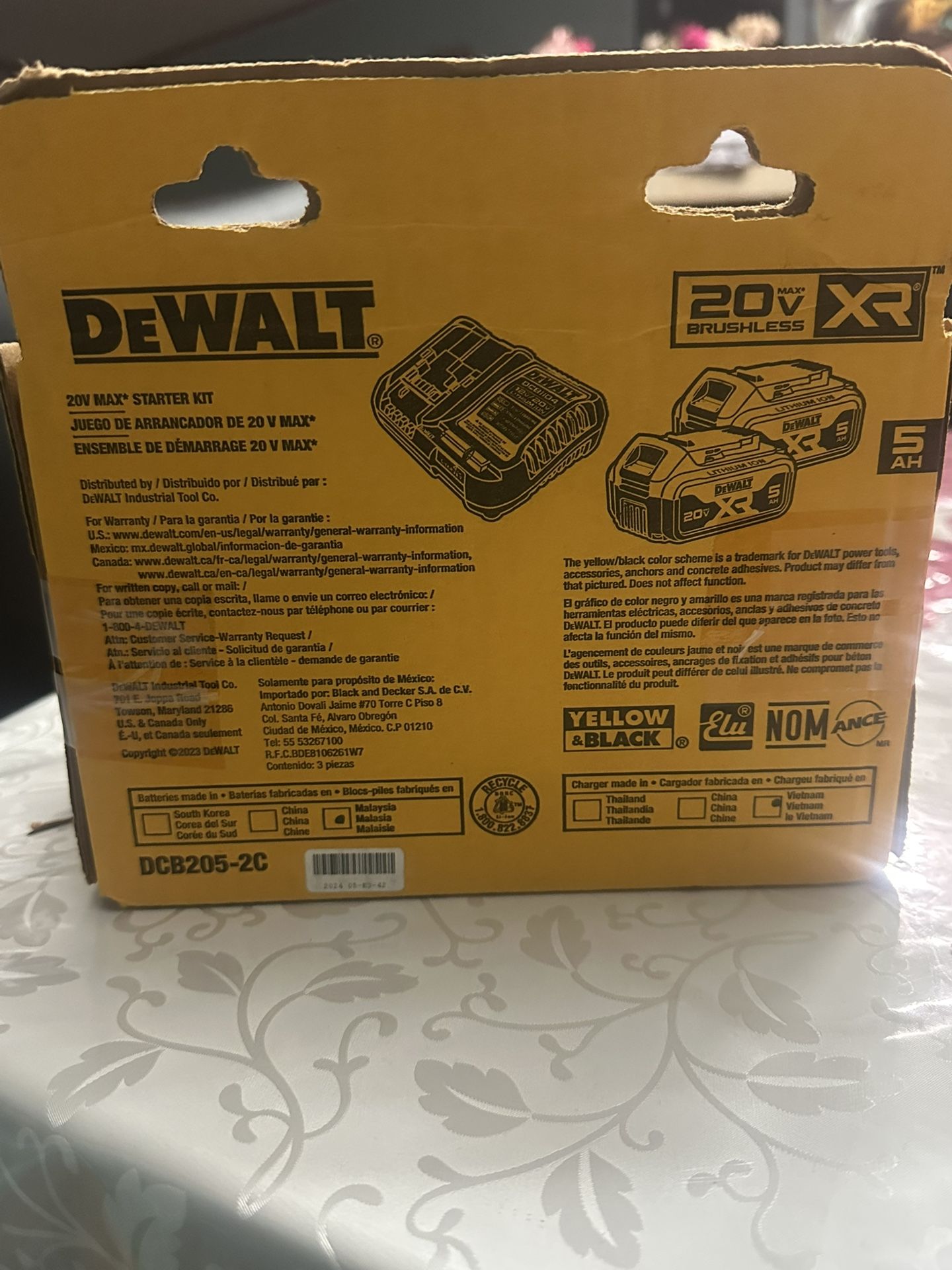Two Walt batteries with their charger