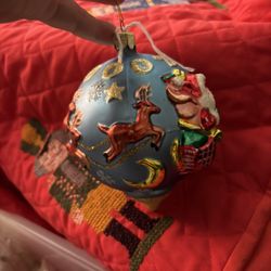 Vintage Beautiful over sized 5 inch glass ball ornament Features Santa in his sleigh and his reindeer 2002 in glitter along the top In excellent condi