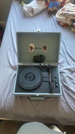 Crosley record player with Tyler, the creator stickers