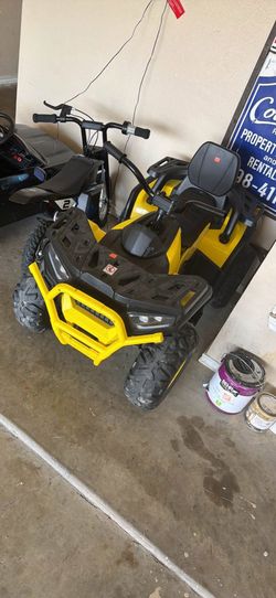 Kids 4 wheeler , electric, yelllow and black