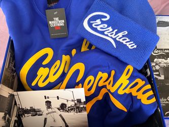 The Marathon (Nipsey) Gift box set in a blue velvet box containing Crenshaw sweater, a T-shirt and a knit cap.