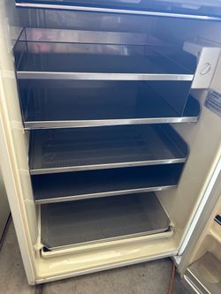 Small upright freezer with shelves