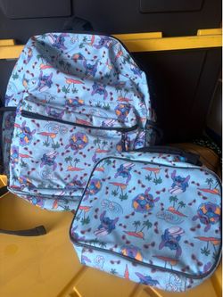 A blue backpack with laundry bag