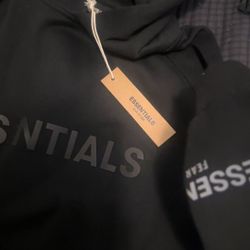 Large black ESSENTIALS HOODIE WITH tags