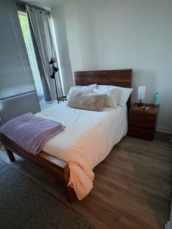 Full size bed with side table