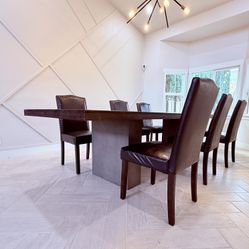 Torian Oak Solid Wood Dining Table + 6 Leather Chairs – $1,250 