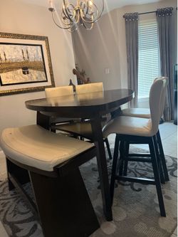 Breakfast table with chairs and bench