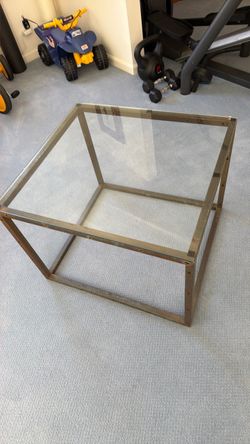 Glass topped brass table