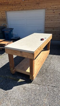 Wooden shop table with wheels very nice table. $ 70