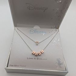 Gorgeous Cubic zirconia-accented two-tone Minnie Mouse pendant and "Love" beads layered necklace. ©Disney