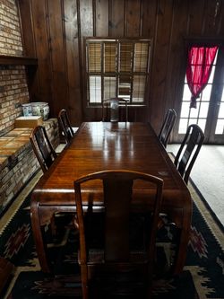 Large wooden dining table and chairs