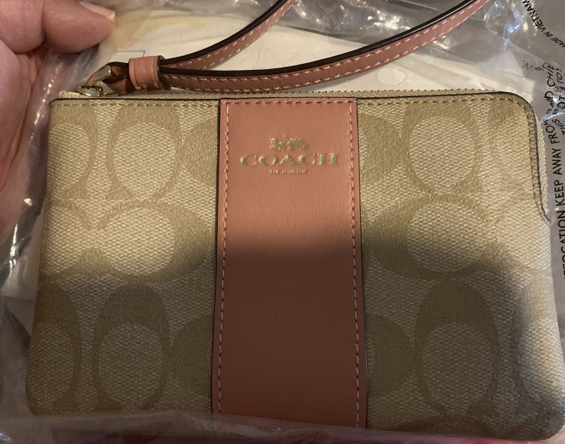 COACH CORNER ZIP WRISTLET IN SIGNATURE CANVAS