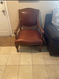 huge leather chair  It’s about  27 inches wide about 31” deep and  39 height