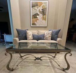 Beautiful Hollywood Regency Style / rectangular glass-top coffee table with an ornate metallic curved iron base