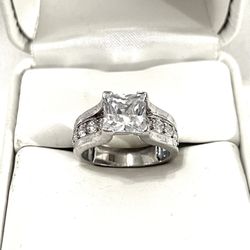 Brand New Princess Cut Cubic Zirconia Diamonds Set In A Sterling Silver Wedding Ring. Size 5 