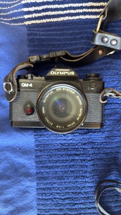 Olympus OM-1 and OM-4 cameras with 24 mm 1.8, 50mm 1.8, Vivitar 70-210 mm 2.8, and Olympus 300mm 4.5
