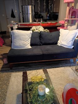 Dark blue sectional ,I use it as a couch and love seat however it does connect. Very comfy.