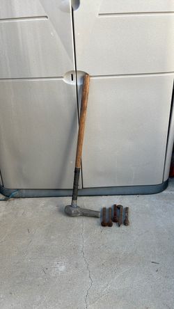 Railroad spike hammer and 5 railroad spikes