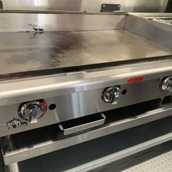 Star max Griddle, APW Gas Char-broiler,  and a 5 Compartment warmer 