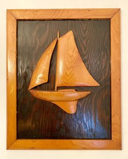 Vintage wood carving of a Star Sailboat