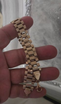 16mm  wide 10k gold rolex bracelet 8 1/2 inches in length no dings has good weight