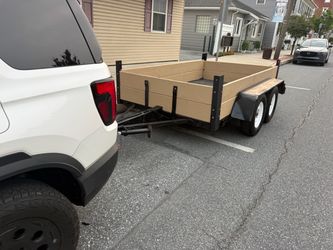 Steel trailer with freshly painted wood slats