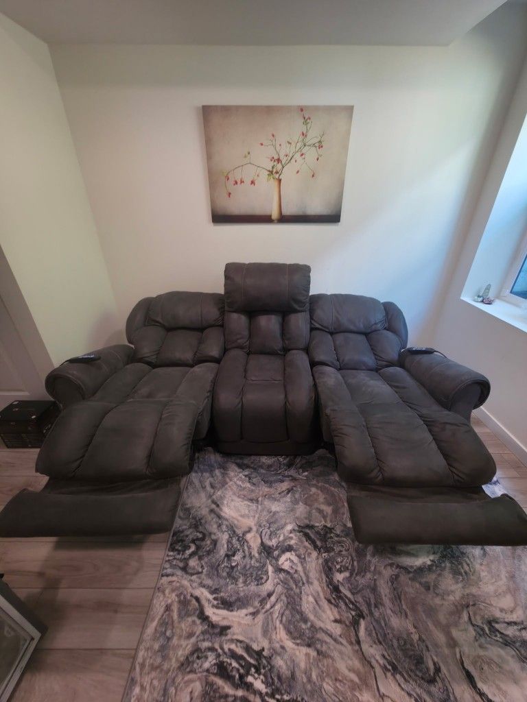 Green/Gray suede memory foam filled dual reclining couch.