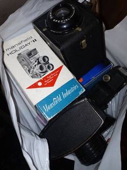 A bag full of vintage cameras