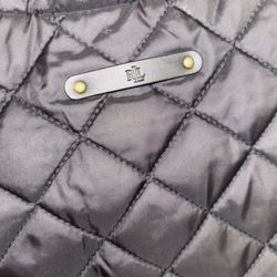 Black quilted vest with gold buttons
