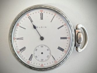 1903 Elgin National Watch Co. Pocket Watch. Has been running the whole time I have been posting this ad. Missing some hands, and some slight cracks on