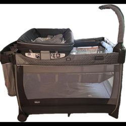 Chicco Lullaby® Zip All-in-One Portable Playard, Infant Bassinet and Changer, Electronic Toy Bar, Toddler Playard, Travel Friendly