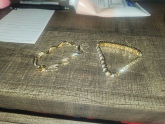 2 gold bracelets with diamonds