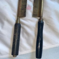 Two antique straightening combs